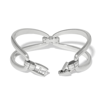 Brighton silver-plated hinged cuff bracelet shown open with polished crossover bands and clasp on a white background
