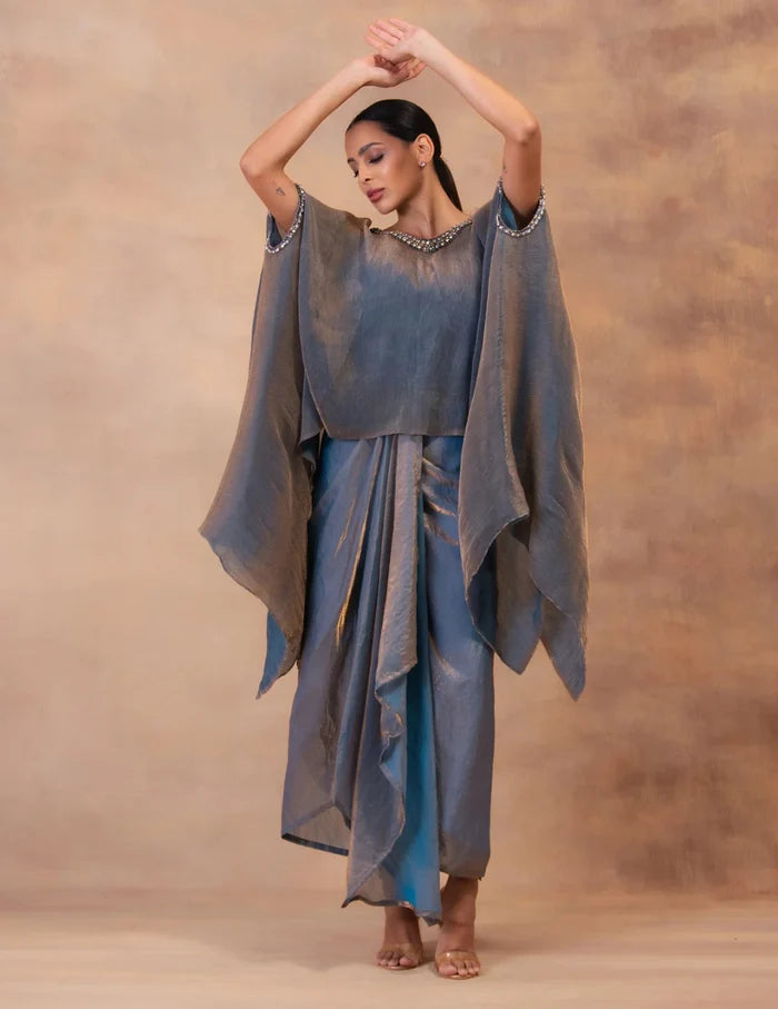 Model wearing the 'METALIC STEEL BLUE' Kaftan & Dhoti Set featuring intricate embroidery and luxurious fabric details in Singapore.