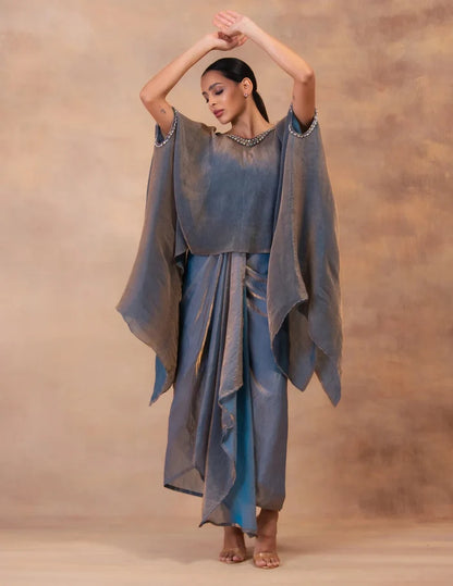 Model wearing the 'METALIC STEEL BLUE' Kaftan & Dhoti Set featuring intricate embroidery and luxurious fabric details in Singapore.