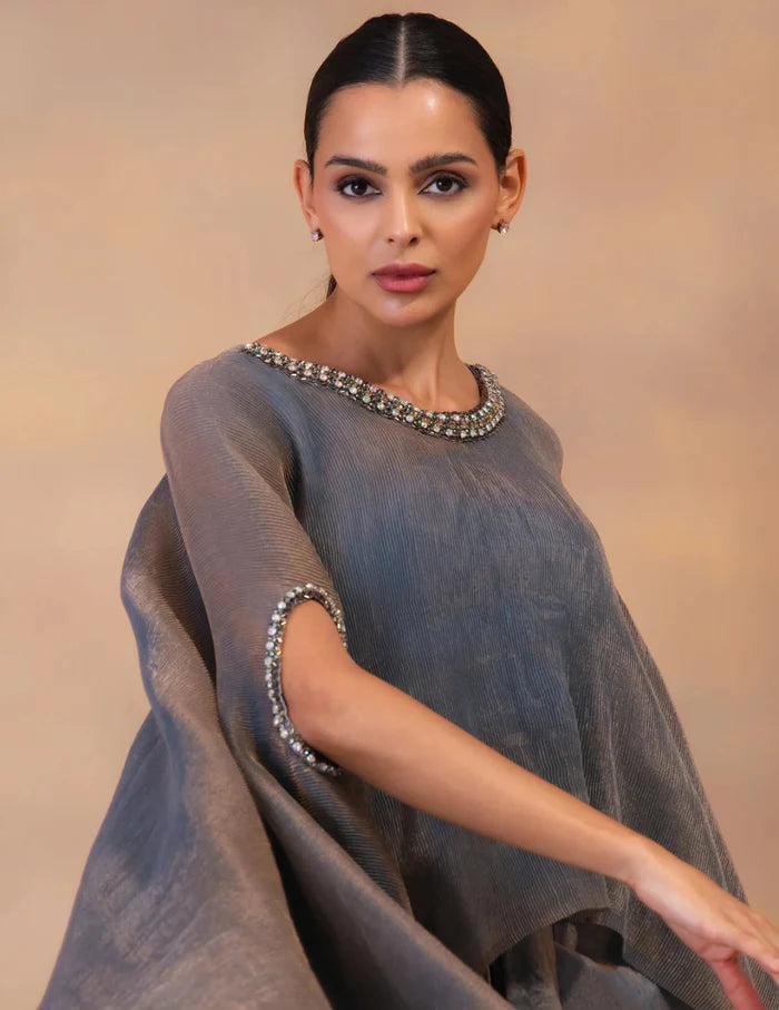 Model wearing the 'METALIC STEEL BLUE' Kaftan & Dhoti Set featuring intricate embroidery and luxurious fabric details in Singapore.