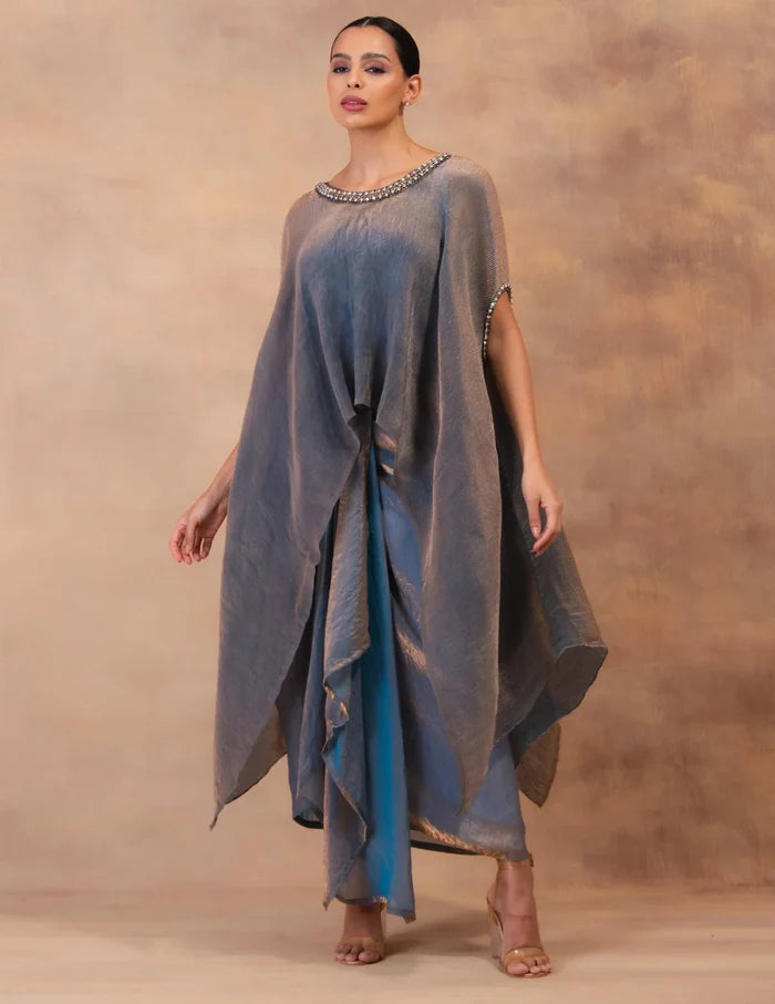 Model wearing the 'METALIC STEEL BLUE' Kaftan & Dhoti Set featuring intricate embroidery and luxurious fabric details in Singapore.
