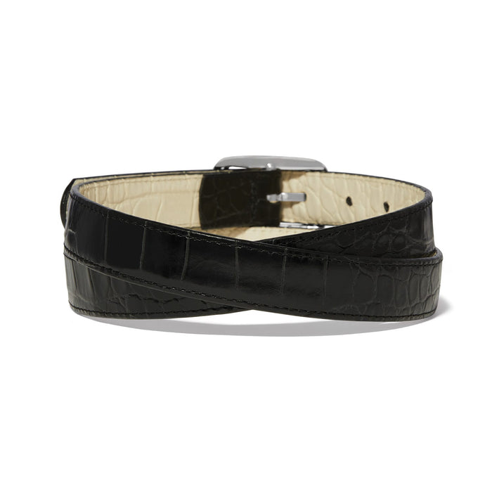 Brighton black leather belt with crocodile-embossed texture and silver-tone buckle, coiled to show interior on a white background