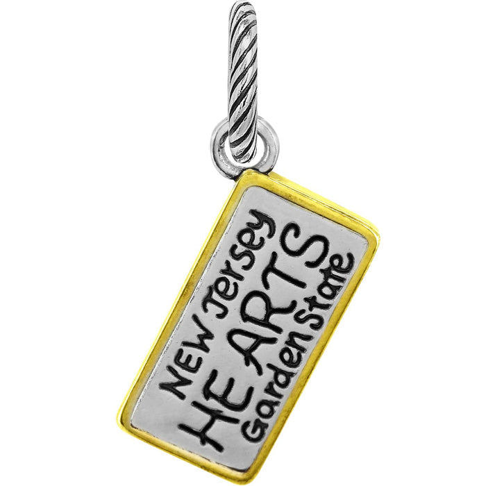 Brighton charm shaped like a New Jersey license plate with two-tone finish and twisted bail on a white background