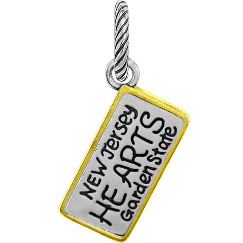 Brighton charm shaped like a New Jersey license plate with two-tone finish and twisted bail on a white background