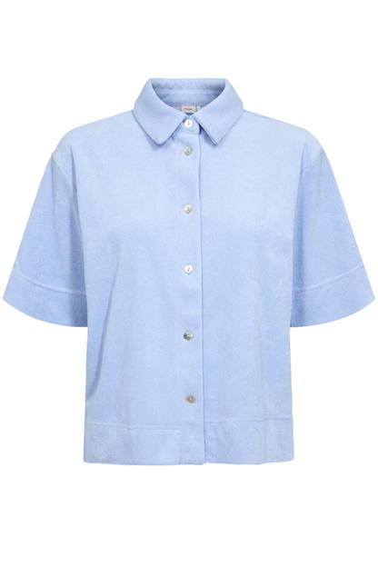 Front view of the Numph 706802 Nualine Short Sleeve Shirt Placid Blue with a classic collar and button closure by Numph. Shop Numph at Dotique.