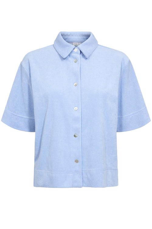 Front view of the Numph 706802 Nualine Short Sleeve Shirt Placid Blue with a classic collar and button closure by Numph. Shop Numph at Dotique.