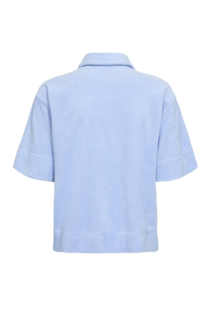 Back view of Numph 706802 Nualine Short Sleeve Shirt Placid Blue by Numph, featuring a relaxed fit and short sleeves. Shop Numph at Dotique.