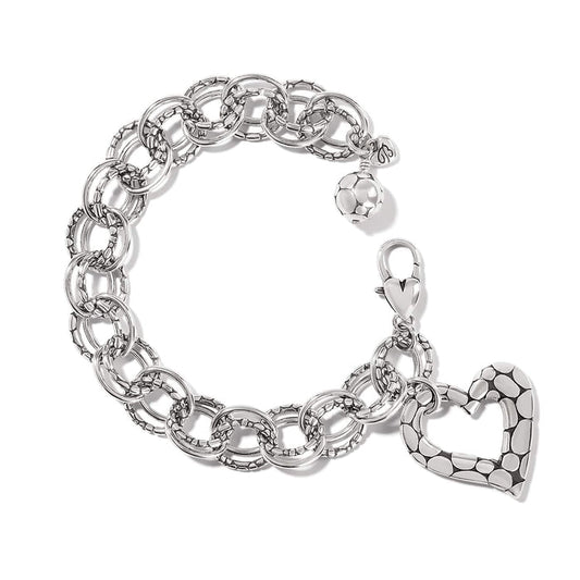 Brighton charm bracelet with silver-plated linked rings, dotted heart charm, and beaded ball accent on a white background