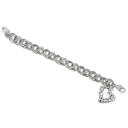 Brighton charm bracelet with silver-plated textured links, heart charm, and lobster clasp on a white background