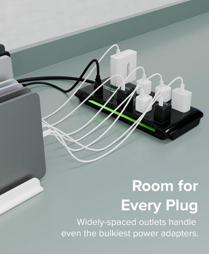 Plugable PS12-USB25 surge protector with widely-spaced AC outlets accommodating multiple bulky power adapters.