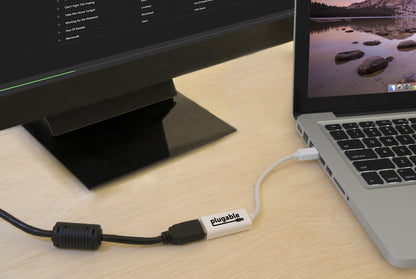 Plugable Mini DisplayPort to HDMI adapter connecting a laptop to an external monitor.
