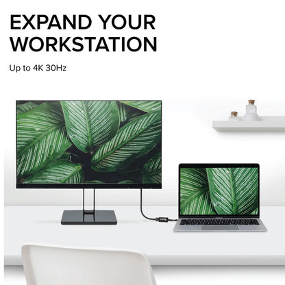 Plugable USB-C to HDMI adapter connecting a laptop to an external monitor, supporting resolutions up to 4K 30Hz.