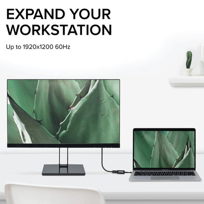 Plugable USBC-TVGA adapter connecting a laptop to a monitor, supporting resolutions up to 1920x1200 at 60Hz.