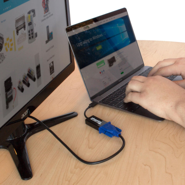 Plugable USBC-VGA adapter connecting a laptop to an external monitor.