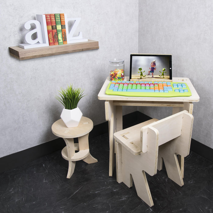 Plugable USB-EZK-G kids keyboard with color-coded, extra-large keys on a wooden desk with a tablet.