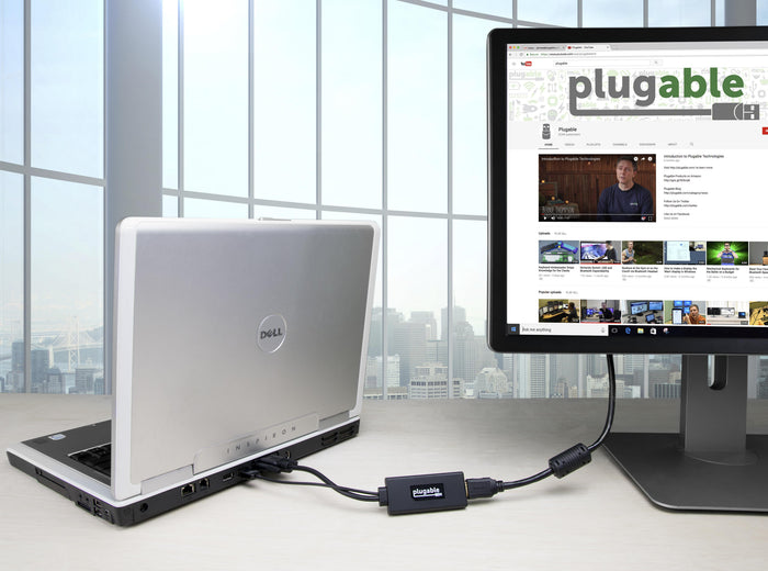 Plugable VGAM-HDMIF VGA to HDMI active adapter connecting a laptop VGA port to an HDMI monitor.