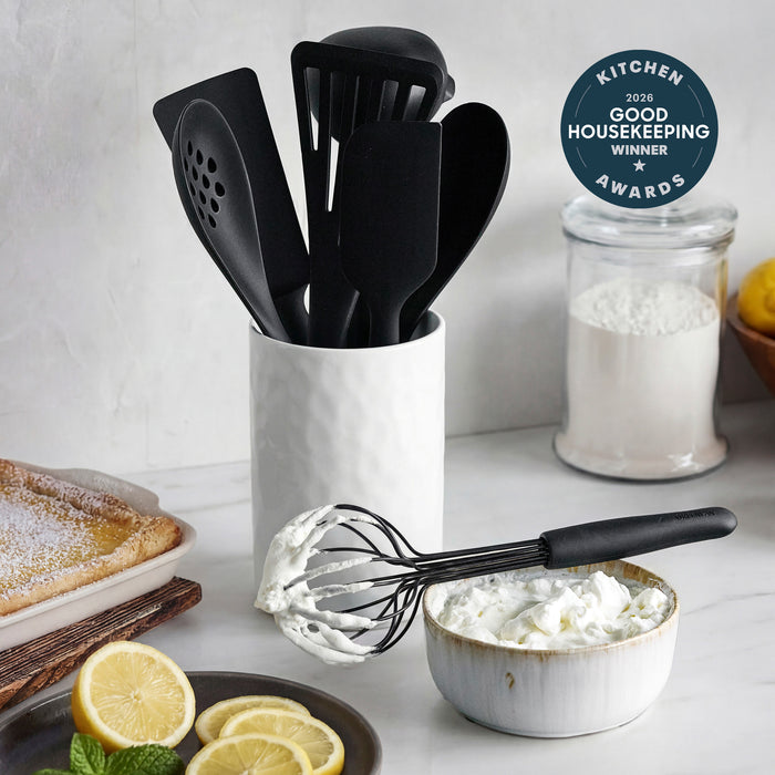 Black silicone 8-piece utensil set in a crock, shown with whipped cream, lemons, and a Good Housekeeping Award badge.