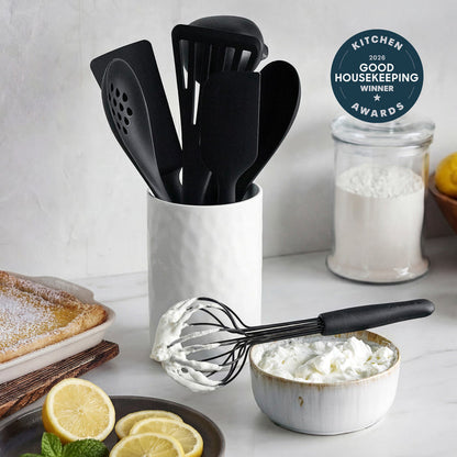 Black silicone 8-piece utensil set in a crock, shown with whipped cream, lemons, and a Good Housekeeping Award badge.