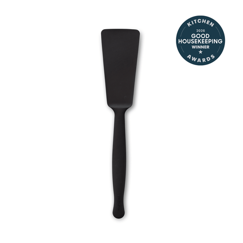 A black Premiere Silicone Burger Turner with a long handle is centered on a white background. In the top right corner, a round blue badge states "2016 Good Housekeeping Kitchen Awards Winner.
