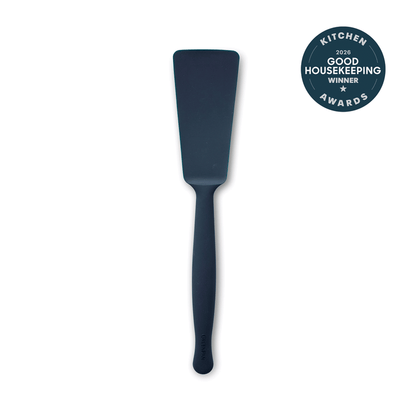 Blue silicone burger turner with a stainless steel handle, single piece.