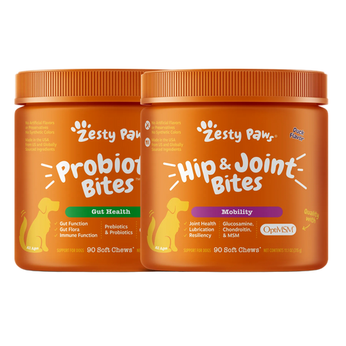 Two orange jars of Zesty Paws dog supplement on a white background