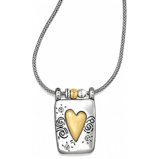 Brighton pendant necklace with brushed gold heart, silver-plated rectangular frame, and swirl engravings on a white background