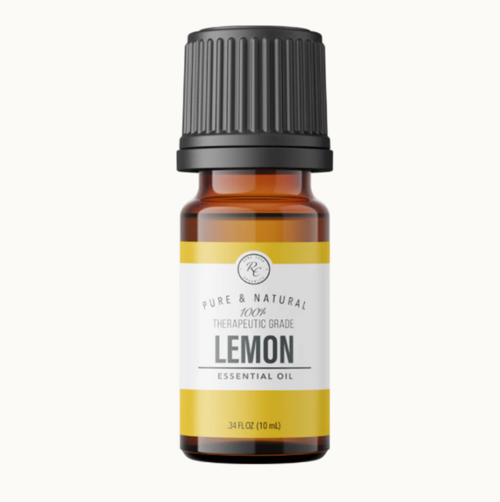 Lemon essential oil bottle with a black cap on a white background