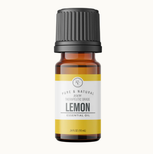 Lemon essential oil bottle with a black cap on a white background