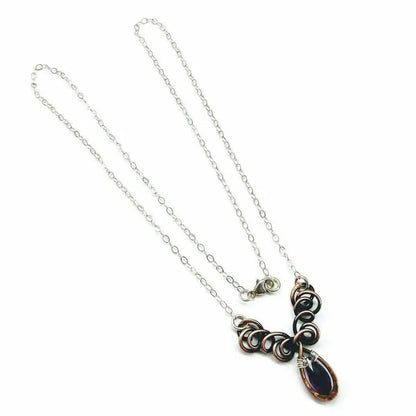 Silver and Copper Wire Sculpted Purple Crystal Drop Necklace with unique wire design and amethyst Swarovski drop.
