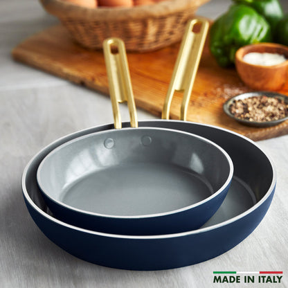 Set of two Marino Blue ceramic frypans with gold handles, labeled Made in Italy, sizes 8 and 10 inches.