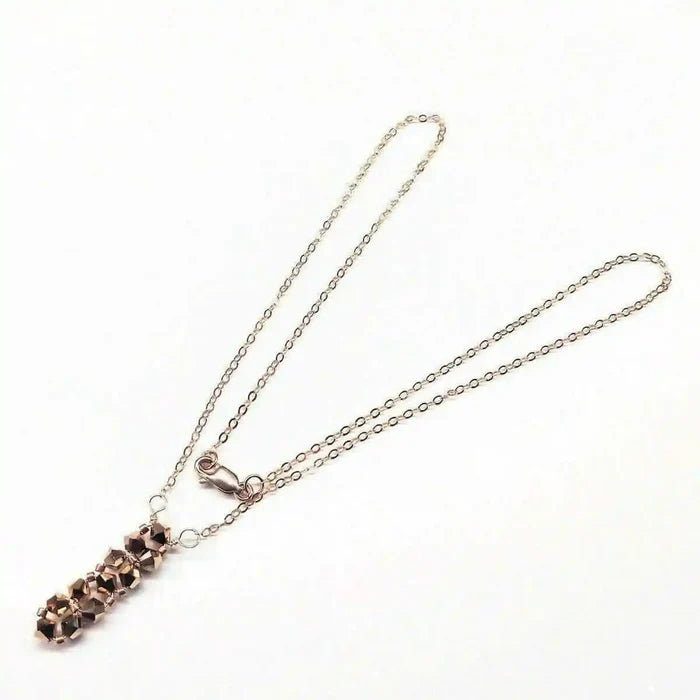 Super Sparkly Rose Gold Rock Candy Crystal Bar Necklace with shimmering Swarovski crystals on a delicate chain.