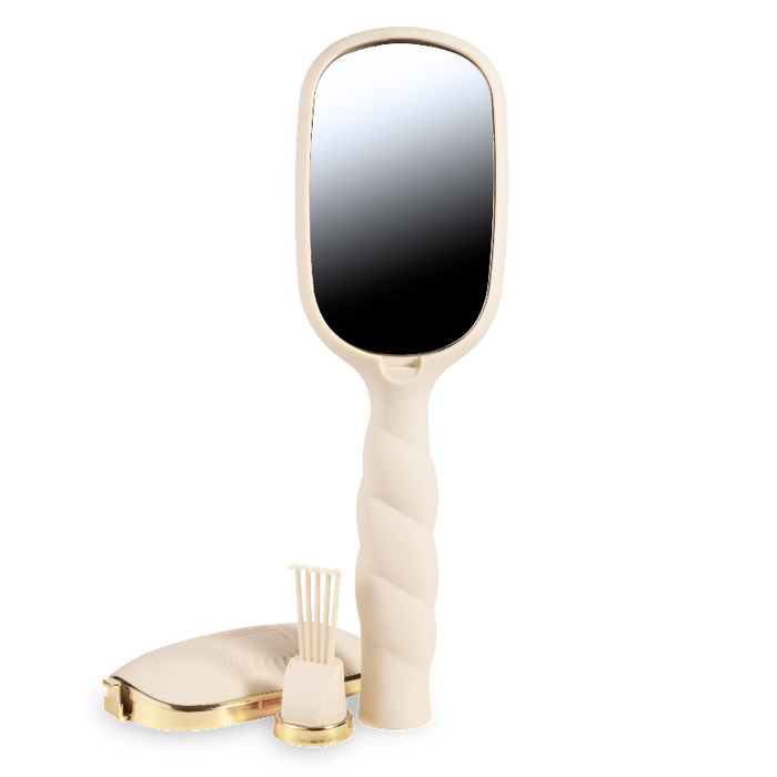 Handheld mirror with a gold and beige handle on a white background