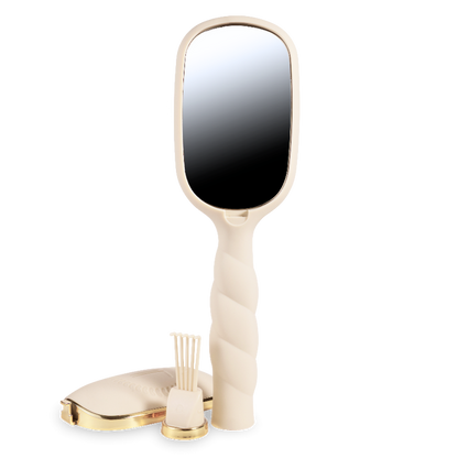 Handheld mirror with a gold and beige handle on a white background