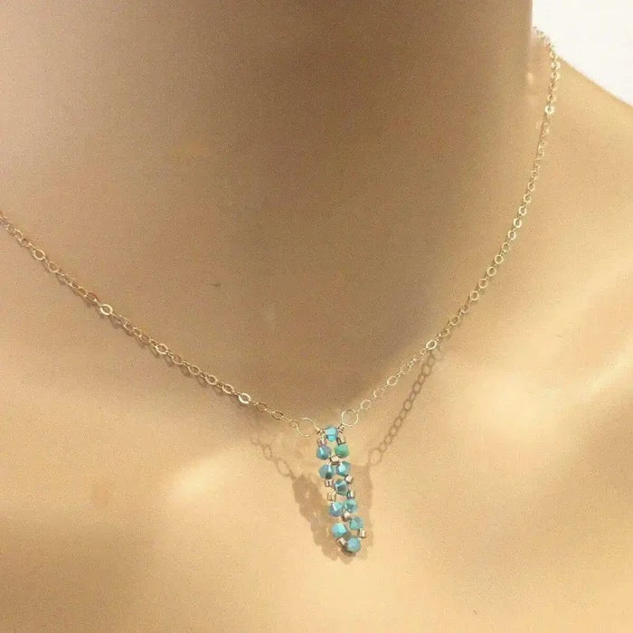 Tiny Super Sparkly Rock Candy Crystal Bar Necklace featuring turquoise Swarovski crystals on a delicate chain.