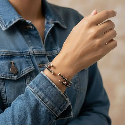 Wire Wrapped Copper Silver Black Crystal Rhinestone Bangle worn on a hand, showcasing elegant design with crystals.