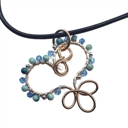 Wire Wrapped Copper Turquoise Heart Infinity Charm Necklace with turquoise beads and Swarovski crystals.