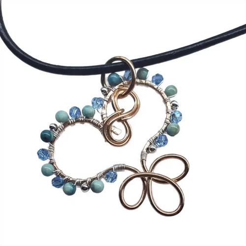 Wire Wrapped Copper Turquoise Heart Infinity Charm Necklace with turquoise beads and Swarovski crystals.