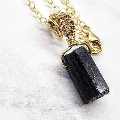 Wire Wrapped Raw Black Tourmaline Gemstone Necklace showcasing a raw black tourmaline crystal in elegant wire wrap.